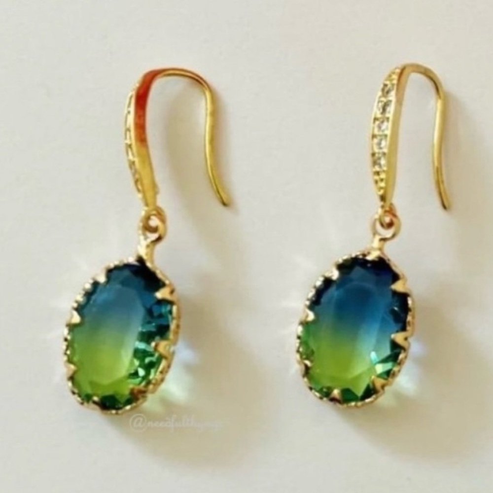 Earrings NIP, Blue/Green crystal in golden base. Over 1/2” stone.
